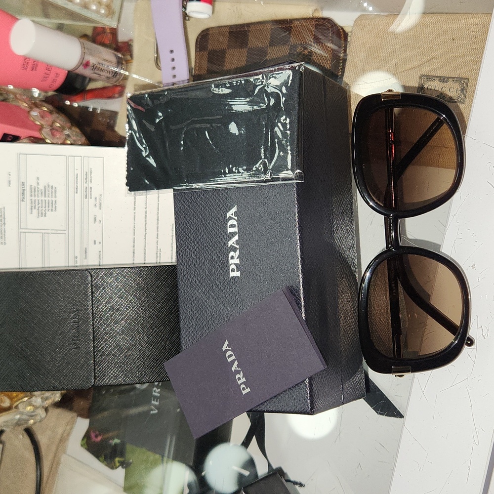 PRADA black sunglasses.